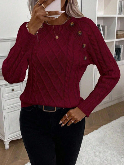 Clara | Trui met knoopdetails en kabelbreisel