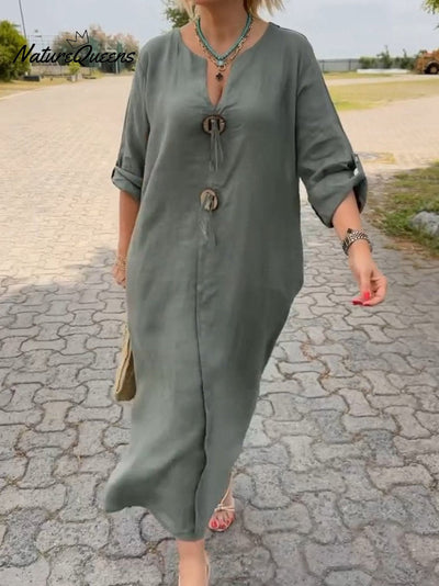 Noor – Lange jurk met houten details en losse mouwen